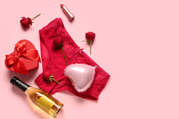 Composition with sexy panties, beautiful gift box, champagne and balloon on pink background. Valentine's Day celebration © Pixel-Shot