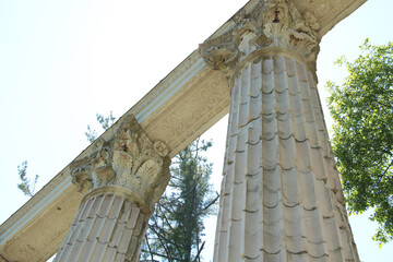 guild guildwood toronto monument pillars shot from low looking up with trees behind