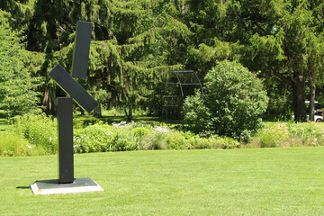 guild guildwood toronto black metal structure made of rectangle black blocks bars on cement...