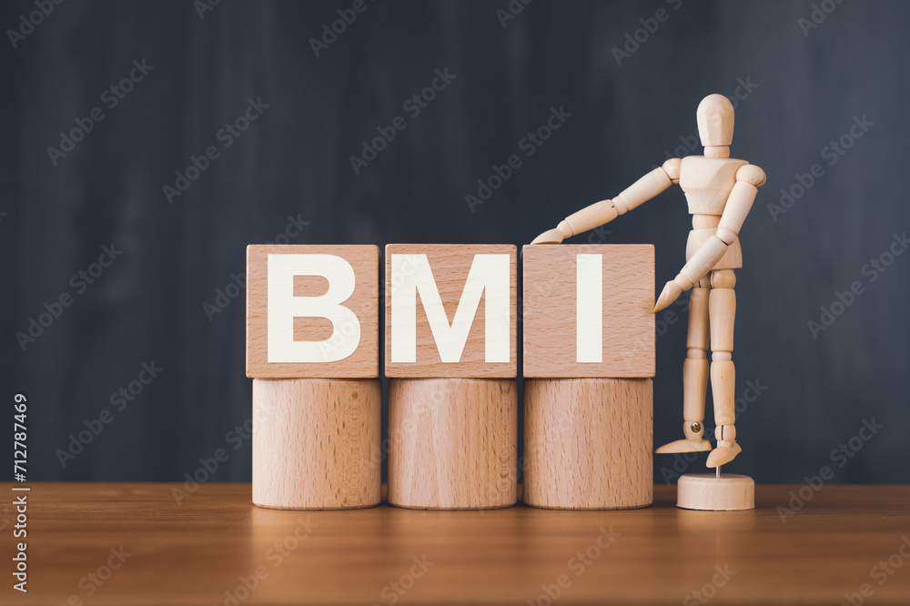 Poster there is wood cube with the word bmi. it is an abbreviation for brain machine interface as eye-catch