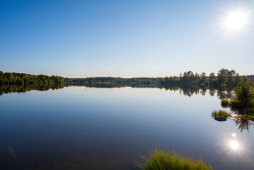 Beautiful sunrise on the lake on a warm summer day