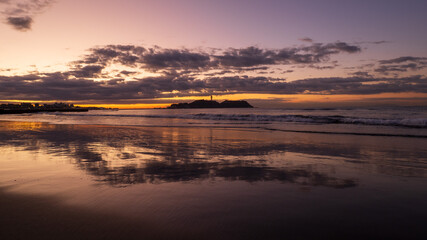 Enoshima island early in the morning with reflection.