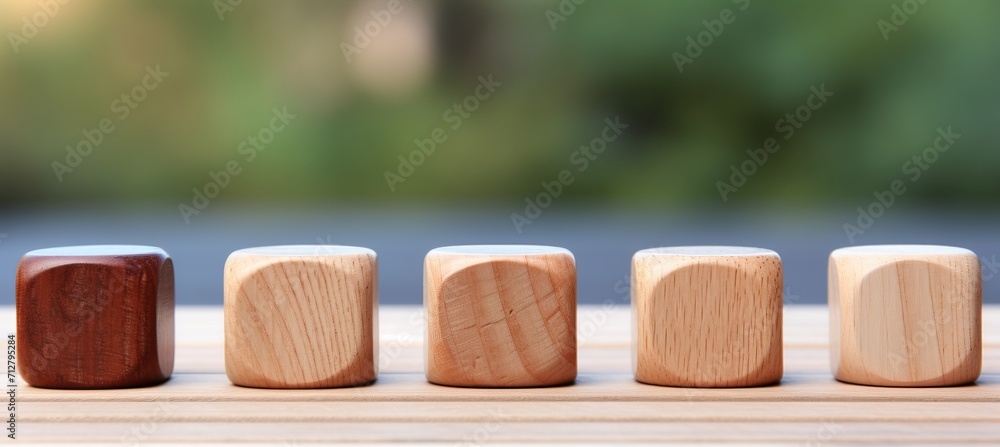 Aufkleber natural wooden blocks in row on magical bokeh background for text placement and design creativity
