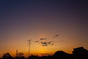 Fototapeta premium Beautiful sunset in the city. Beautiful sky with clouds at sunset.