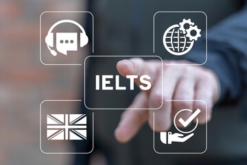 Man using virtual touch screen sees acronym: IELTS. Concept of IELTS International English Language...