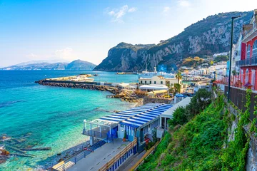 Fototapeten Bay on the island of Capri, small marina with crystal clear turquoise sea water,Capri-napoles- Italy. © Pedro Emanuel 