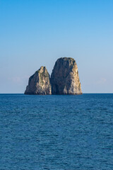 Fototapeta na wymiar beautiful cliffs by the beach of the small marina .Island of Capri, Naples, Italy