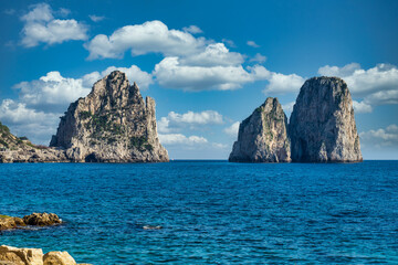 Fototapeta na wymiar beautiful cliffs by the beach of the small marina .Island of Capri, Naples, Italy