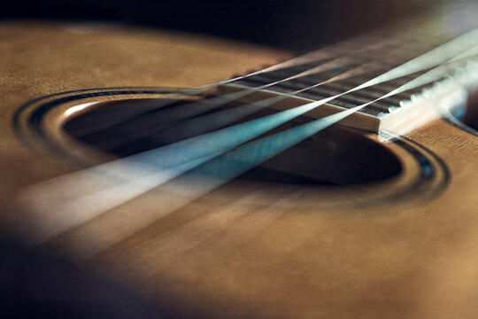 Flat top acoustic guitar with strings wood top and fretboard