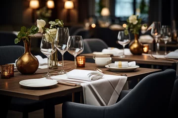 Foto op Plexiglas An elegantly set dining table in a hotel restaurant, complete with polished silverware and fine china. Concept of refined dining experience. Generative Ai. © Sebastian