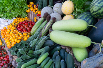 Closeup with top view, Vegetables, and Fruits patterns. Decorate with many types of vegetables and fruits. Nature vibrant fruits including tomatoes decorate the background.