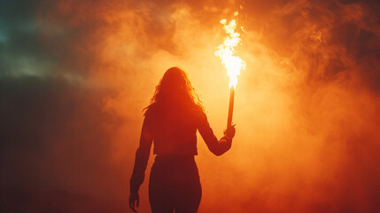 A powerful image of a woman holding a torch, representing leadership, knowledge, and enlightenment.