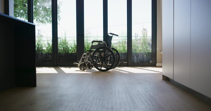 Wheelchair, living room and house for handicap equipment nursing home and lounge floor with sunlight. Window, couch and hospital with medicare, shadow and furniture with loss, empty and death