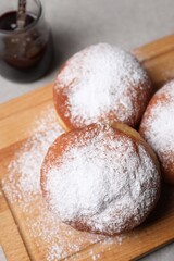 Fototapeta na wymiar Delicious sweet buns with jam on table, closeup