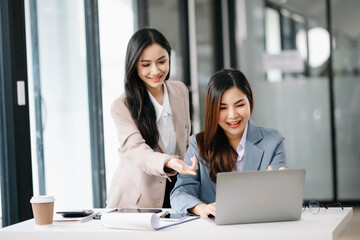 Portrait of success business people working together in office. Couple teamwork startup concept.