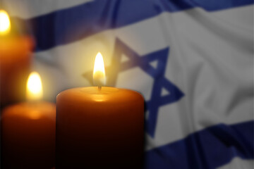 Burning candles against flag of Israel, closeup