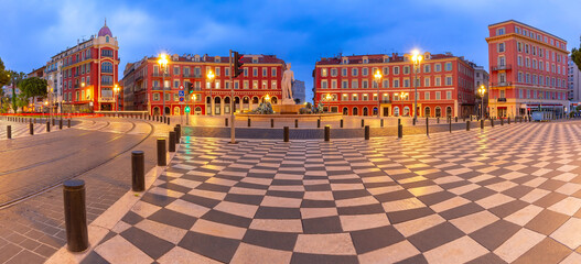 Panorama of square Place Massena with Fountain du Soleil at night in Nice, French Riviera, France