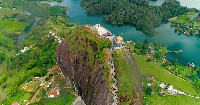 Aerial drone shot that shows the top of El Pe&ntilde;ol Rock Medellin.