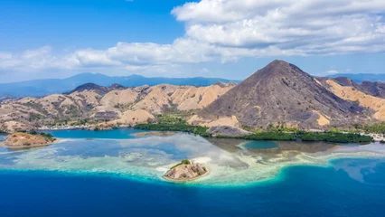 Foto op Canvas Aerial view of beaches and tourist boat sailing in Kelor Island, Flores Island, Indonesia © Yusnizam Yusof