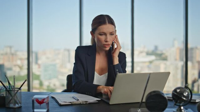 Successful lawyer consulting mobile phone in office. Busy sales manager calling 