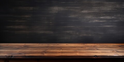 Textured wooden table top against a dark interior background for showcasing products or designing visuals.