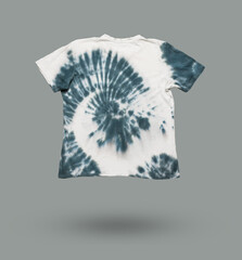 White and gray tie dye T-shirt on a gray background.