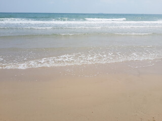 Fototapeta na wymiar beautiful beach with waves and sea