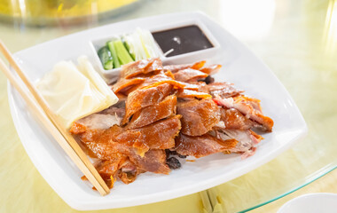 Chinese food, Beijing duck or roast ducks with sauce and vegetables