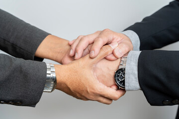 Businessmen shake hands, end of meeting, business concept. Two happy businessman handshake over the...