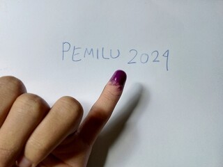 Illustration of the 2024 Presidential Election in Indonesia. Someone's finger is inked as a sign...