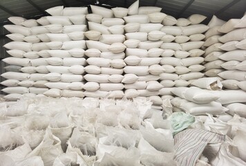 White sack stack in storage room or warehouse