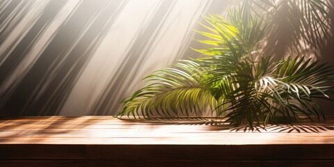 Sunlight shining through a window onto a wooden table with palm leaves