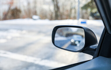 car mirror reflecting past, present, and future, symbolizing the journey of life and the pursuit of dreams