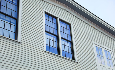 suburban house symbolizing the American Dream, amidst a thriving neighborhood, capturing the essence of homeownership in a dynamic real estate market