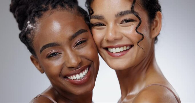 Women, face and skincare with diversity in studio with facial treatment, happiness or glowing skin. Friends, model and portrait with beauty for cosmetics, dermatology and support on gray background