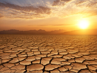 Arid Clay soil Sun desert global worming concept cracked scorched earth soil drought desert landscape dramatic sunset
