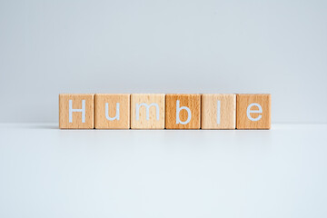 Wooden blocks form the text "Humble" against a white background.