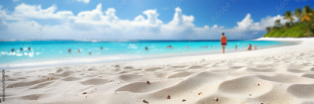 Wall mural Tropical beach with white sand and turquoise water. Blur image of people walking on beach, panoramic banner