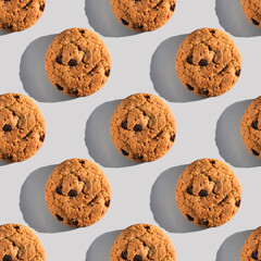 Oatmeal cookie pattern with sharp shadow on gray background