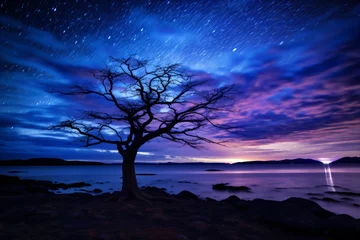 Fototapeten Night time beach photography with night sky and a beautiful landscape © Tarun