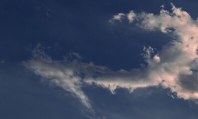Naklejka na ściany i meble Cloud shaped like a bent arrow isolated in the sky