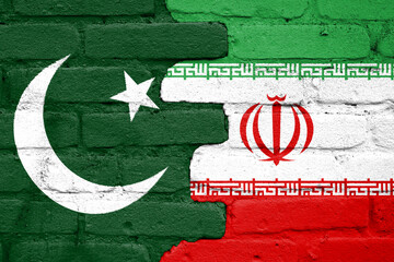 Flags of Pakistan and Iran painted on a brick wall - obrazy, fototapety, plakaty