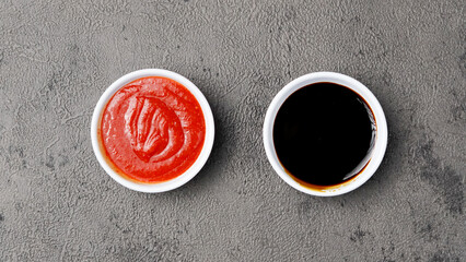 three sauces ketchup mayonnaise, sweet soy sauce and chili sauce in black bowl isolated on white...