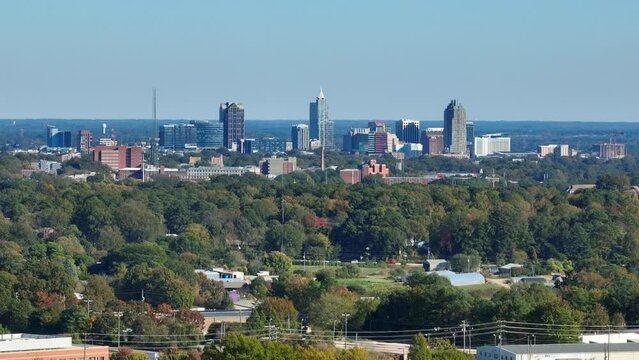 Raleigh, North Carolina skyline from a distance. Aerial with zoom lens.