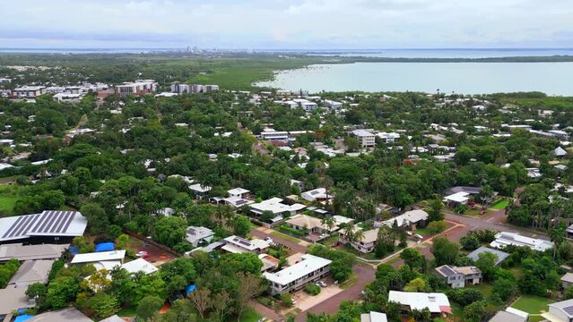 Aerial Drone Ocean Sea Beachside Residential Living In Nightcliff Darwin NT Australia with CBD City in Background