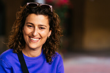 Smiling attractive woman on street