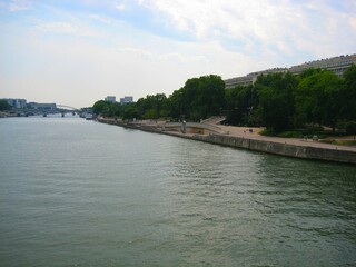 Seine river and Tino Rossi Garden in summer in Paris, France