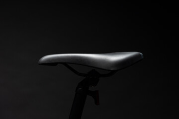 Black mountain bicycle on black background close up