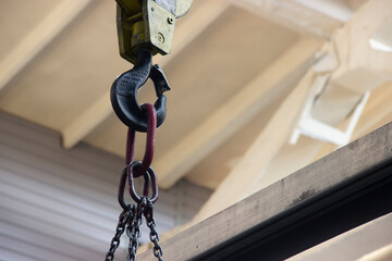 Metal hook from crane beam