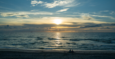 Sunset sea. Calm sea with sunset sky through the clouds over. Meditation ocean and sky background. Tranquil seascape. Horizon over the sunset sea water. Calm sea with sunset sky.